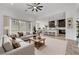 Open-concept living room flows into kitchen featuring an expansive window and abundant natural light at 281 Gandara St, Las Vegas, NV 89138