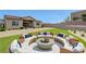 Inviting outdoor seating area with plush cushions, perfect for entertaining in the landscaped backyard at 281 Gandara St, Las Vegas, NV 89138