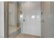 Modern glass shower featuring stylish tile, a built-in bench, and contemporary fixtures at 281 Gandara St, Las Vegas, NV 89138