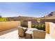 A balcony offers seating and views of nearby mountains, landscaping and neighborhood features at 29 Blue Valley Dr, Henderson, NV 89002