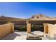 A balcony provides seating and views of mountains, landscaping and homes at 29 Blue Valley Dr, Henderson, NV 89002