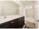 Functional bathroom with a double sink vanity, shower-tub, and neutral colors at 29 Blue Valley Dr, Henderson, NV 89002