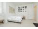 Bright bedroom with a map accent wall, a neutral carpet, and a comfortable bed at 29 Blue Valley Dr, Henderson, NV 89002
