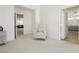 Cozy sitting area in bedroom with comfortable chair and ample natural light at 29 Blue Valley Dr, Henderson, NV 89002
