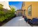Long driveway along the side of the house with garage access on the side at 29 Blue Valley Dr, Henderson, NV 89002