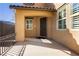Inviting front entrance with a decorative wreath on the brown door and shuttered windows at 29 Blue Valley Dr, Henderson, NV 89002