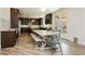 Spacious eat-in kitchen with dark wood cabinets, stainless steel appliances, and backyard access at 29 Blue Valley Dr, Henderson, NV 89002
