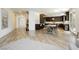 Open-concept kitchen with dark wood cabinetry, stainless steel appliances, and a spacious layout at 29 Blue Valley Dr, Henderson, NV 89002