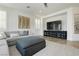 Cozy living room with plush seating, a large screen television, and stylish decor at 29 Blue Valley Dr, Henderson, NV 89002