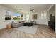 Bright living room featuring a large sectional sofa, shutters, and mountain views at 29 Blue Valley Dr, Henderson, NV 89002