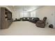 Spacious living room with large sectional sofa and built-in media center with shelving at 29 Blue Valley Dr, Henderson, NV 89002