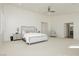 Large main bedroom featuring a ceiling fan, neutral colors, and an ensuite bathroom at 29 Blue Valley Dr, Henderson, NV 89002