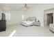 Bright main bedroom with neutral color scheme, ceiling fan, and natural light at 29 Blue Valley Dr, Henderson, NV 89002