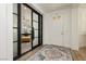 Bright entryway leading into an office space with shutters and stylish furnishings at 29 Blue Valley Dr, Henderson, NV 89002