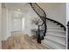 Elegant staircase with wrought iron railing and carpeted steps, leading to the upper level at 29 Blue Valley Dr, Henderson, NV 89002