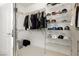 Spacious walk-in closet with shelving for clothes, shoes, hats, and ample storage at 29 Blue Valley Dr, Henderson, NV 89002