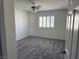 Bright and airy bedroom with ceiling fan and plush carpeting offers plenty of natural light at 311 Glenoaks St, Pahrump, NV 89048