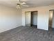 Bedroom features neutral carpet and mirrored closet doors at 311 Glenoaks St, Pahrump, NV 89048