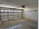Spacious two-car garage featuring concrete flooring and an insulated garage door at 311 Glenoaks St, Pahrump, NV 89048