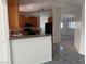 Kitchen featuring wooden cabinets, tile flooring, and a granite countertop at 311 Glenoaks St, Pahrump, NV 89048