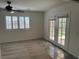 The additional living room features new carpet, shuttered windows, and a double-door entrance to patio at 311 Glenoaks St, Pahrump, NV 89048