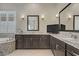 A luxurious bathroom features dual vanities, granite countertops, and a separate tub at 3155 Dalmazia Ave, Henderson, NV 89044