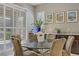 The dining area showcases a glass table, comfortable seating, and plenty of natural light at 3155 Dalmazia Ave, Henderson, NV 89044