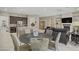 Open dining area with stylish table and chairs, flowing into the kitchen and living spaces at 3155 Dalmazia Ave, Henderson, NV 89044