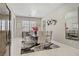 The spacious dining room has a stylish chandelier and modern decor at 3155 Dalmazia Ave, Henderson, NV 89044