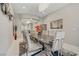 The spacious dining room has a stylish chandelier and modern decor at 3155 Dalmazia Ave, Henderson, NV 89044