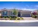 Beautiful home featuring desert landscaping, and a two-car garage at 3155 Dalmazia Ave, Henderson, NV 89044