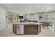 A gourmet kitchen featuring stainless appliances, a large island and gorgeous countertops at 3155 Dalmazia Ave, Henderson, NV 89044