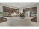 A gourmet kitchen featuring stainless appliances, a large island and gorgeous countertops at 3155 Dalmazia Ave, Henderson, NV 89044