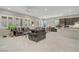 Spacious living room featuring tile floors, modern furniture, and large windows for natural light at 3155 Dalmazia Ave, Henderson, NV 89044