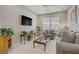 Cozy living room with neutral tones, plantation shutters, and comfortable furnishings at 3155 Dalmazia Ave, Henderson, NV 89044