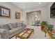 Inviting living room with stylish decor and open layout to dining area at 3155 Dalmazia Ave, Henderson, NV 89044