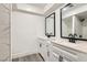 Bright bathroom featuring modern vanity with dual sinks and a sleek black faucet design at 3310 Heritage Pl, Las Vegas, NV 89121