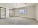 Bright bedroom with large window and mirrored closet providing ample storage space at 3310 Heritage Pl, Las Vegas, NV 89121