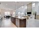 Expansive living space includes a modern kitchen, dining area, and living room with a stone fireplace at 350 Gandara St, Las Vegas, NV 89138