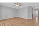 Bedroom with wood floors, crown molding, ceiling fan, and plenty of natural light at 4227 Pacifico Ln, Las Vegas, NV 89135