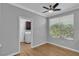 Bright bedroom with a ceiling fan and large window at 4227 Pacifico Ln, Las Vegas, NV 89135