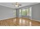 Large bedroom with wood floors and a window provides natural light and ventilation at 4227 Pacifico Ln, Las Vegas, NV 89135