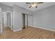 Bedroom features wood floors and a mirrored closet, with a door leading to other rooms at 4227 Pacifico Ln, Las Vegas, NV 89135
