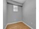 Simple bedroom with hardwood floors and one window at 4227 Pacifico Ln, Las Vegas, NV 89135