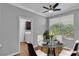 Cozy dining room with modern furnishings and a view into laundry room at 4227 Pacifico Ln, Las Vegas, NV 89135