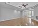 Open living room with hardwood floors, fireplace, and access to outdoor space at 4227 Pacifico Ln, Las Vegas, NV 89135