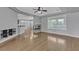 Bright living room featuring hardwood flooring, fireplace, and large windows at 4227 Pacifico Ln, Las Vegas, NV 89135