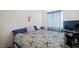 Bedroom features a comfy bed, a television and bright, natural light at 4336 Desert Dancer Way, Las Vegas, NV 89147
