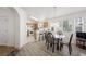 Bright dining area next to kitchen with breakfast bar, lots of natural light and modern laminate flooring at 4336 Desert Dancer Way, Las Vegas, NV 89147
