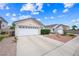 Charming single-story home featuring a well-maintained front yard and a two-car garage at 4336 Desert Dancer Way, Las Vegas, NV 89147